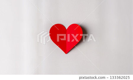 A voluminous red paper heart with a shadow on a clean light background. Minimalism. 133362025