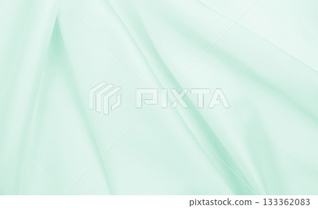 Smooth elegant green silk or satin luxury cloth texture as abstract background. Luxurious background design Smooth elegant green silk or satin luxury cloth texture as abstract background. Luxurious background design 133362083