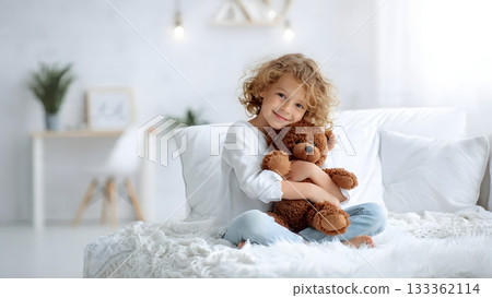 Happy young boy with curly hair smiles while hugging a large brown teddy bear, sitting on a fluffy white bed in a bright modern room. AI Generated Happy young boy with curly hair smiles while hugging a large brown teddy bear, sitting on a fluffy white bed in a bright modern room. AI Generated 133362114
