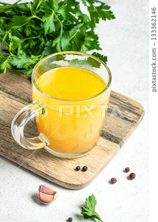Beef bone broth with herbs 133362146