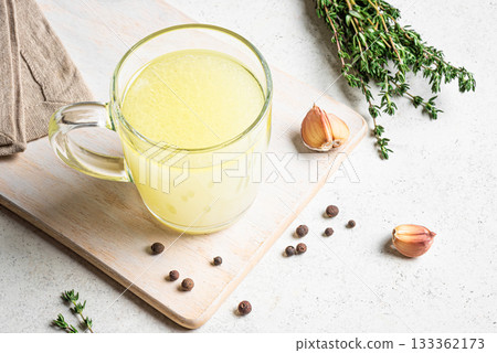 Hot healing bouillon (chicken bone broth) 133362173