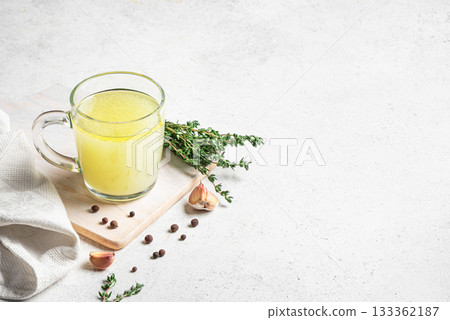 Hot delicious bouillon (bone broth) in mug Hot delicious bouillon (bone broth) in mug 133362187