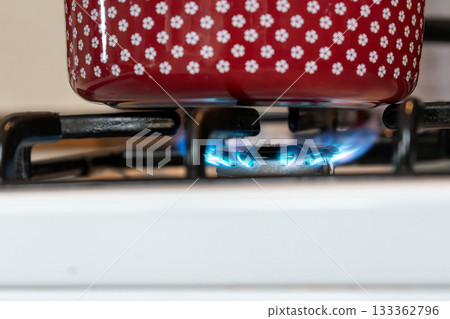 Saucepan on gas stove, gas cooker in the kitchen Saucepan on gas stove, gas cooker in the kitchen 133362796