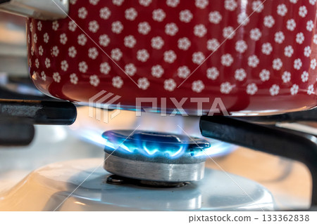 Saucepan on gas stove, gas cooker in the kitchen 133362838