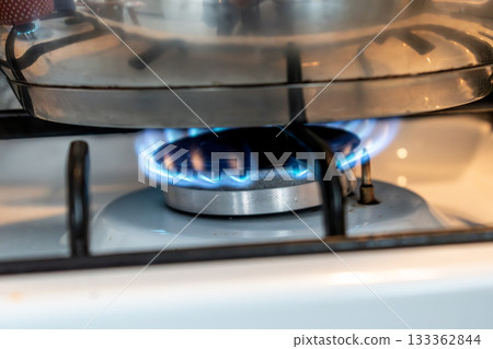 Saucepan on gas stove, gas cooker in the kitchen 133362844