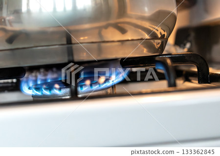 Saucepan on gas stove, gas cooker in the kitchen 133362845