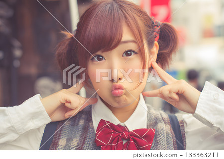 A portrait of a Japanese female student with a pouting face. A striking photograph that conveys emotional expression and student life. 133363211
