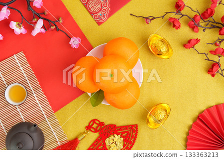 Chinese New Year fruits and decorations symbolizing good fortune and prosperity 133363213