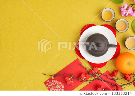 Chinese New Year tea ceremony with traditional teapot and festive decorations 133363214