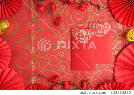 Chinese New Year red envelopes and decorations on ornate background 133363220