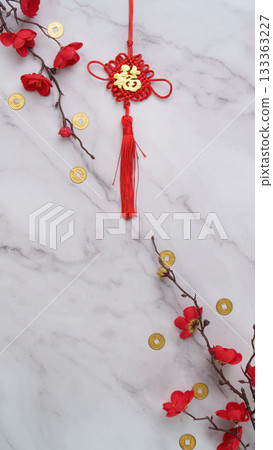 Chinese New Year decorative tassel with red flowers and coins 133363227
