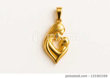 Gold pendant of mother holding baby symbolizing maternal love and care 133363389