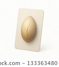 Cracked beige egg on white card isolated on white background 133363480