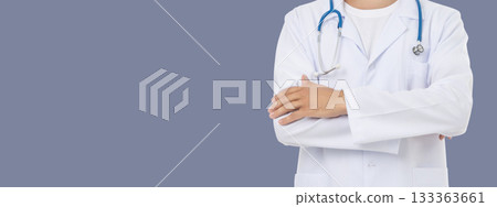 Healthcare worker poses with arms crossed, space for text 133363661