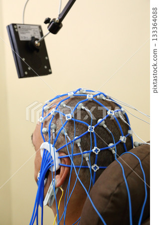 Electroencephalography (EEG) procedure. A noninvasive medical test that measures the brain's electrical activity. Electroencephalography (EEG) procedure. A noninvasive medical test that measures the brain's electrical activity. 133364088
