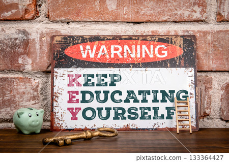 Vintage Warning Sign with Motivational Message Keep Educating Yourself on Brick Wall Background Vintage Warning Sign with Motivational Message Keep Educating Yourself on Brick Wall Background 133364427