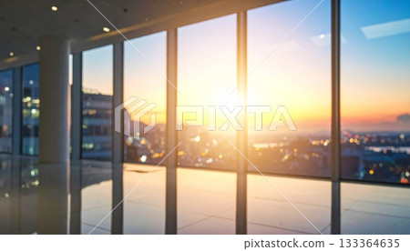 The long glass hallway of a modern office building interior is empty, showing bright light through the window and an architectural design 133364635