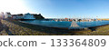 Harbor Panorama With Boats, Pier And Lighthouse In Sunny Coastal Town 133364809