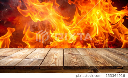 Warm orange and red flames from a burning wood fire in a dark fireplace 133364916