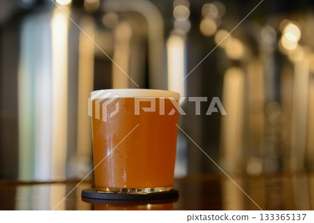 Ale-style craft beer displayed on the taproom counter 133365137