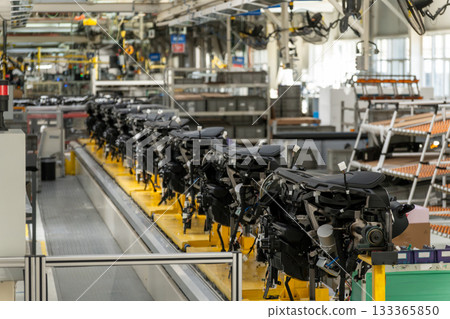 Automated production line moves car chassis or engine assemblies 133365850