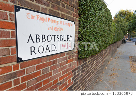Abbotsbury Road W14 street sign on brick wall, Kensington and Chelsea, London, UK 133365973