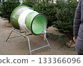The christmas tree wrapping device Packed in a plastic net 133366096