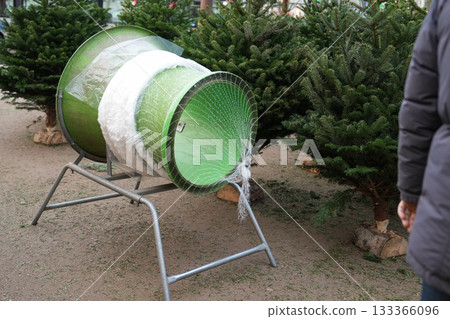 The christmas tree wrapping device Packed in a plastic net The christmas tree wrapping device Packed in a plastic net 133366096