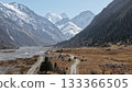Majestic mountain landscape with winding river and snow-capped peaks 133366505