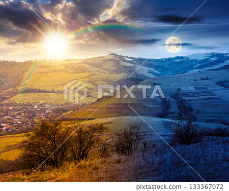 countryside mountain landscape on autumn equinox. day and night time change. alps with sun and moon. beautiful place. scenery with forest on hills. beauty in nature and rural sustainability concept 133367072