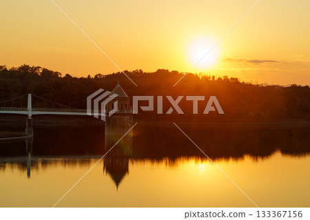 Lake Sayama's water intake tower bathed in the setting sun 133367156