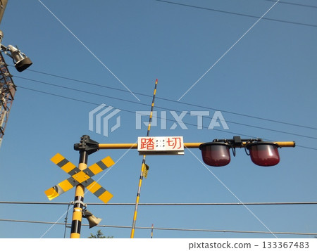 Railroad crossing and sky 133367483