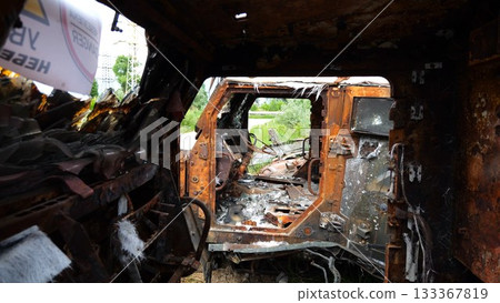 Rusty and burned-out armored vehicles on ukrainian territory. Exhibition of destroyed military equipment of the russian army. War between Ukraine and russia. Close up Slow motion 133367819