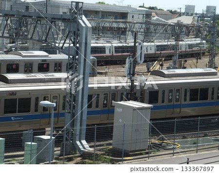 Trains running parallel to each other in front of Sagami-Ono Station Trains running parallel to each other in front of Sagami-Ono Station 133367897