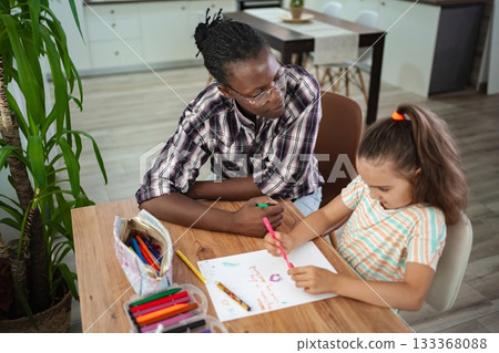 Engaging art session between adult and child at cozy table Engaging art session between adult and child at cozy table 133368088