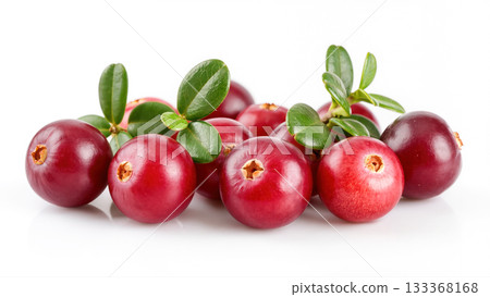 Fresh ripe cranberries with green leaves isolated on white background. Close-up of juicy red berries with smooth texture and natural shine. 133368168