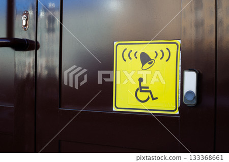 Concept for assisting people with disabilities. Universal sign for people with disabilities showing location to press help button. Press button and receive assistance 133368661