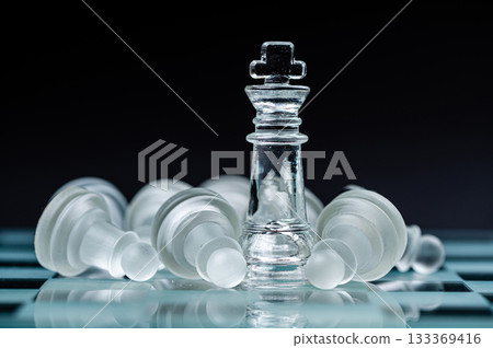 glass chess board game in black background ,selective focus on King, winner concept glass chess board game in black background ,selective focus on King, winner concept 133369416