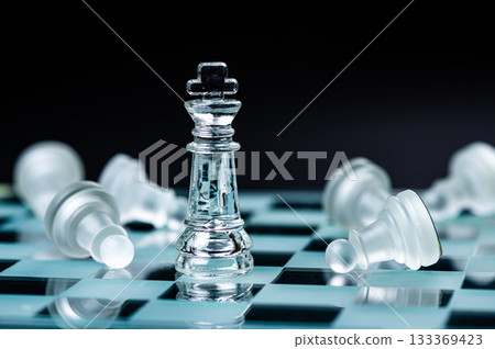glass chess board game in black background ,selective focus on King, leadership concept glass chess board game in black background ,selective focus on King, leadership concept 133369423