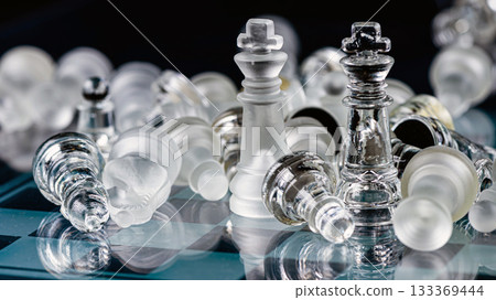 glass chess board game in black background ,selective focus on King, leadership concept 133369444
