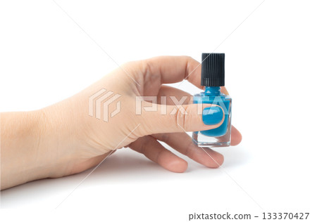 Applying nail polish in close-up. Getting manicures on your own at home 133370427