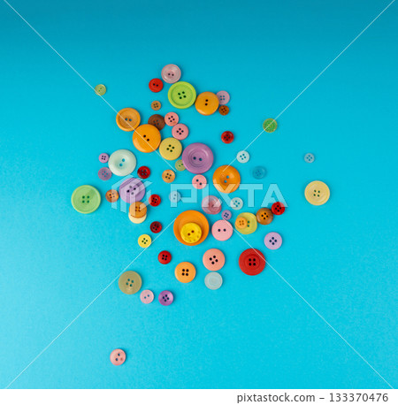 Multicolored sewing buttons. Plastic sew buttons of different colors and sizes 133370476