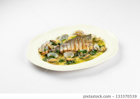 Grilled fish fillet with clams in herb sauce Grilled fish fillet with clams in herb sauce 133370539