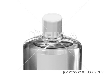 A transparent bottle of hair growth product with a screw cap A transparent bottle of hair growth product with a screw cap 133370915