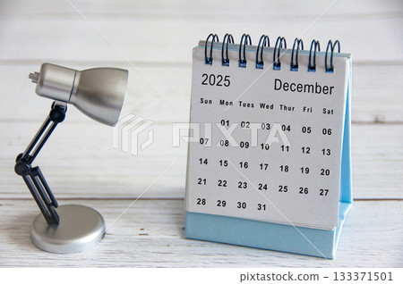 White December 2025 calendar on wooden cover background. Year end concept. 133371501