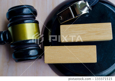 Top view of lawyer gavel with blank wooden blocks with customizable space for text. Law and speak up concept. Top view of lawyer gavel with blank wooden blocks with customizable space for text. Law and speak up concept. 133371515
