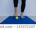 performing barefoot drills with small balls to improve stability and strengthen toes manually 133372107