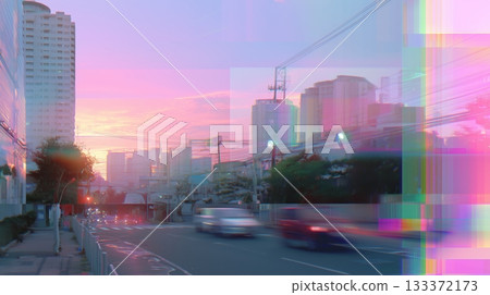 City skyline at sunset with vibrant colors and blurred traffic on a busy road 133372173