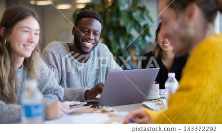 Group of diverse people collaborating on a project in a bright office environment 133372292