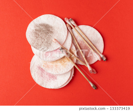 Dirty Cotton Pads and Swabs, Makeup Removal, Used Cotton Disks after Makeup Cleansing Dirty Cotton Pads and Swabs, Makeup Removal, Used Cotton Disks after Makeup Cleansing 133373419